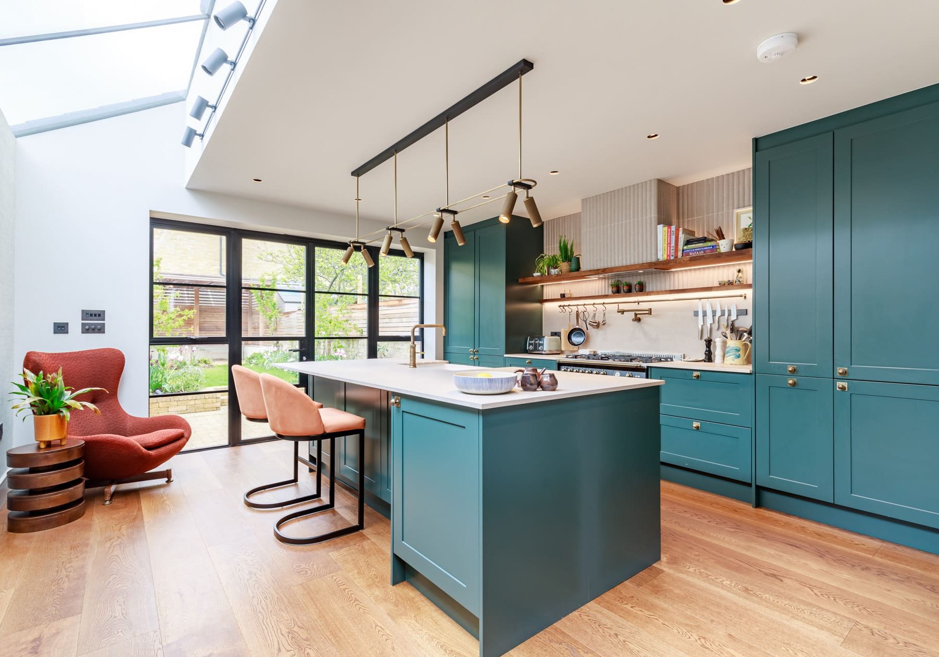 blue shaker kitchen with hanging lights